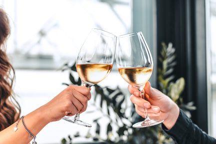 women cheers with wine of the month rose